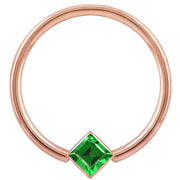 14k rose gold fixed bead ring with green princess-cut CZ in corner bezel setting, front view