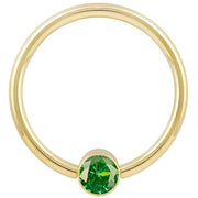 14k yellow gold green CZ bezel fixed bead ring, smaller gauge shown front view on white background