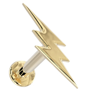 14k yellow gold lightning bolt flat back labret stud, angled view showing bolt shape and flat disc backing
