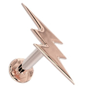 14k rose gold lightning bolt flat back labret stud, angled view showing warm blush-toned bolt and disc back