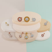 CZ milgrain flat back labret studs displayed in yellow gold, rose gold, and white gold color options