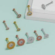 Diamond milgrain flat back labret studs in three gold tones showing size variation, teal background