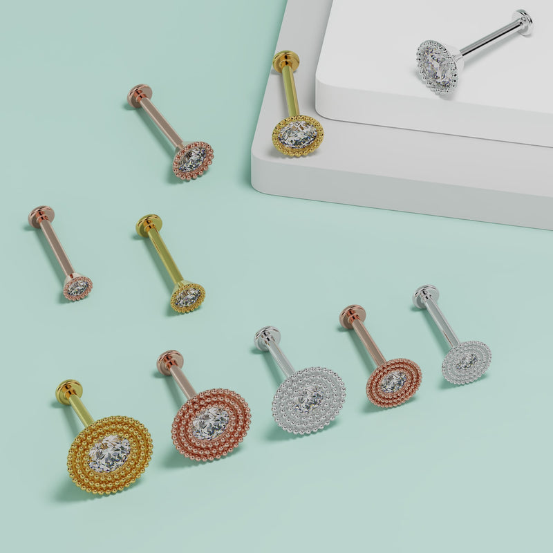 2mm diamond milgrain flat back studs in yellow, rose, and white gold shown in multiple sizes on teal surface