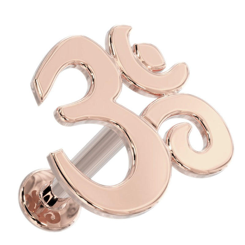 14k rose gold Om symbol flat back labret stud, angled view showing post and decorative flat backing