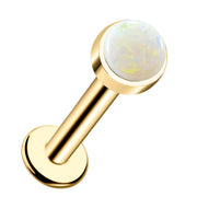 14k yellow gold flat back labret stud with 3mm white opal cabochon in bezel setting, front view