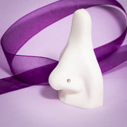 2mm pearl bezel-set flat back stud worn in nose piercing on white display form