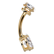 Side profile of 14k yellow gold oval CZ belly ring showing curved barbell and prong setting depth