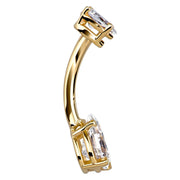 Edge-on side view of 14k yellow gold dual pear CZ navel ring showing barbell curve profile