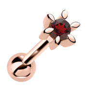 14k rose gold flower cartilage stud with deep red garnet gemstone, front view