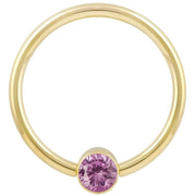 14k yellow gold fixed bead ring with light pink CZ bezel bead, smaller gauge front view