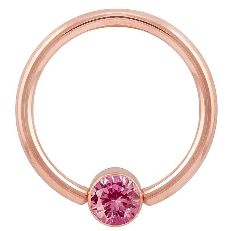 14k rose gold fixed bead ring with bright pink round-cut CZ in bezel setting, front view