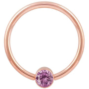 14k rose gold fixed bead ring with light pink CZ bezel bead, smaller gauge front view