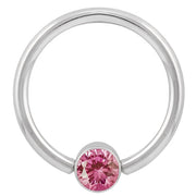 14k white gold fixed bead ring with pink round-cut CZ bezel setting, front view