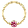 14k yellow gold fixed bead ring with bright pink round-cut CZ in bezel setting, front view
