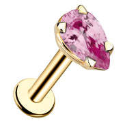 14k yellow gold pear-cut pink tourmaline flat back labret stud, angled view showing prong setting