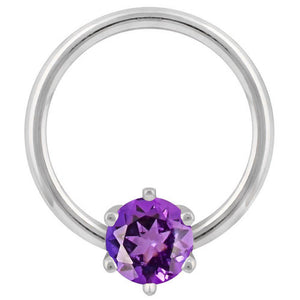 14k white gold captive bead ring with purple cubic zirconia prong-set stone, front view