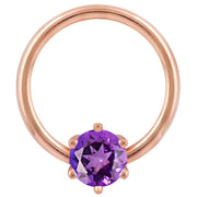 14k rose gold fixed bead ring with round purple cubic zirconia in six-prong setting, front view