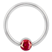 14k white gold fixed bead ring with round red cubic zirconia bezel, angled front view
