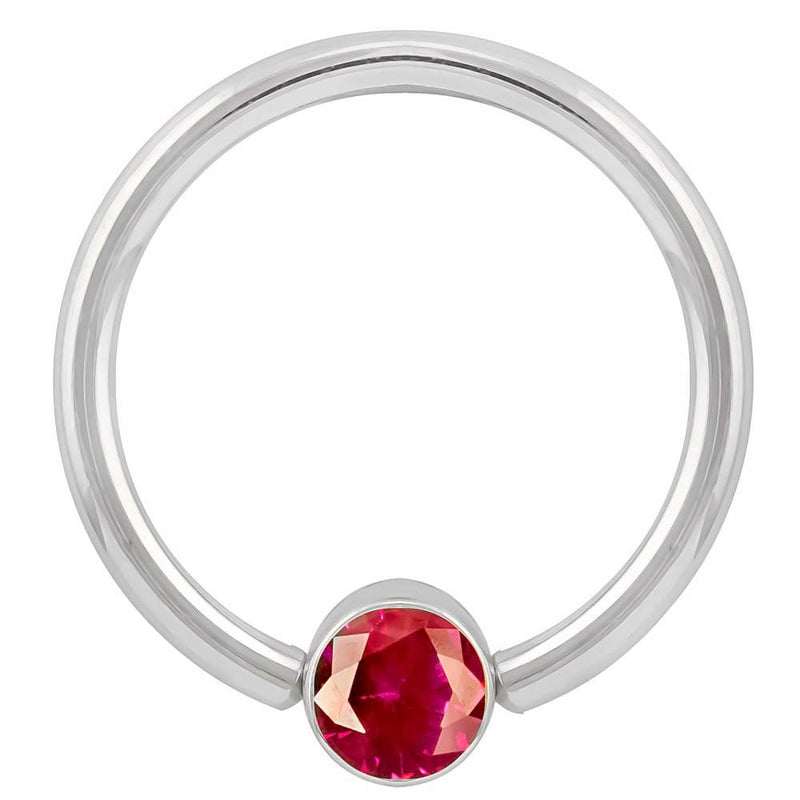 14k white gold fixed bead ring with round red cubic zirconia bezel, angled front view