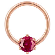 14k rose gold fixed bead ring with deep red round CZ in prong setting, front view