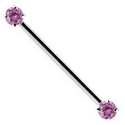14k white gold industrial barbell with pink CZ ends, prong-set round-cut gems, front view
