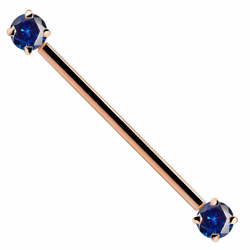 14k rose gold industrial barbell with dual blue round CZ gems in prong settings, front view