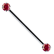 14k white gold industrial barbell with dual red CZ prong-set ends, front view on white background