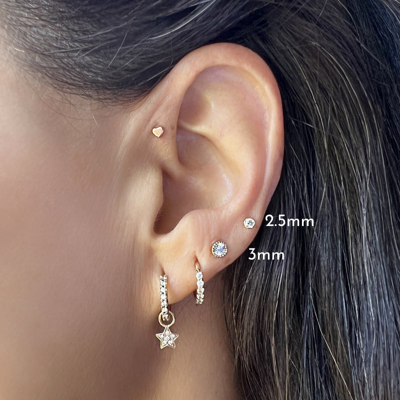 2.5mm diamond milgrain flat back stud worn in helix piercing, size comparison showing 2.5mm and 3mm