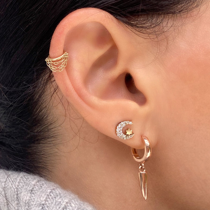 14k gold chain clicker hoop worn in helix piercing, styled with gold ear stack