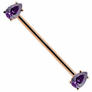 14k rose gold industrial barbell with purple pear-cut cubic zirconia ends, diagonal product view