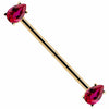 14k yellow gold industrial barbell with dual red pear-cut CZ gems in prong settings, angled view