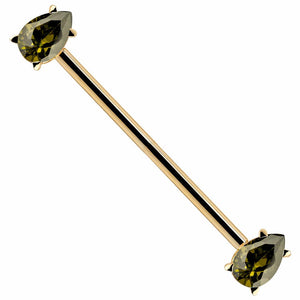 14k yellow gold industrial barbell with two pear-cut light green CZ gems in prong settings, diagonal view
