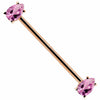 14k rose gold industrial barbell with pink pear-cut CZ gems in prong settings, diagonal view