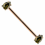 14k rose gold industrial barbell with light green teardrop CZ gems in prong settings, diagonal view