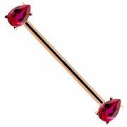 14k rose gold industrial barbell with red pear-cut CZ gemstones in prong settings, angled view