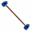 14k rose gold industrial barbell with dual blue teardrop CZ gems in prong settings, diagonal view