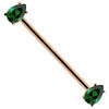14k rose gold industrial barbell with dual green pear-cut CZ gems in prong settings, white background