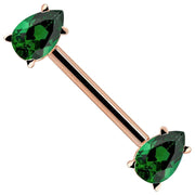 14K rose gold straight barbell with dual emerald-green pear-cut CZ ends, angled view