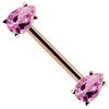 14K rose gold straight barbell with dual pink pear-cut CZ gemstones, angled view showing warm gold tone