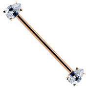 14k rose gold industrial barbell with dual clear teardrop cubic zirconia ends, full-length diagonal view