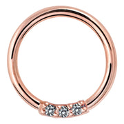 14K rose gold seam ring with three front-facing VS1 diamonds, front view on white background