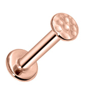 14K rose gold hammered disc flat back labret stud, angled view highlighting warm tone and texture