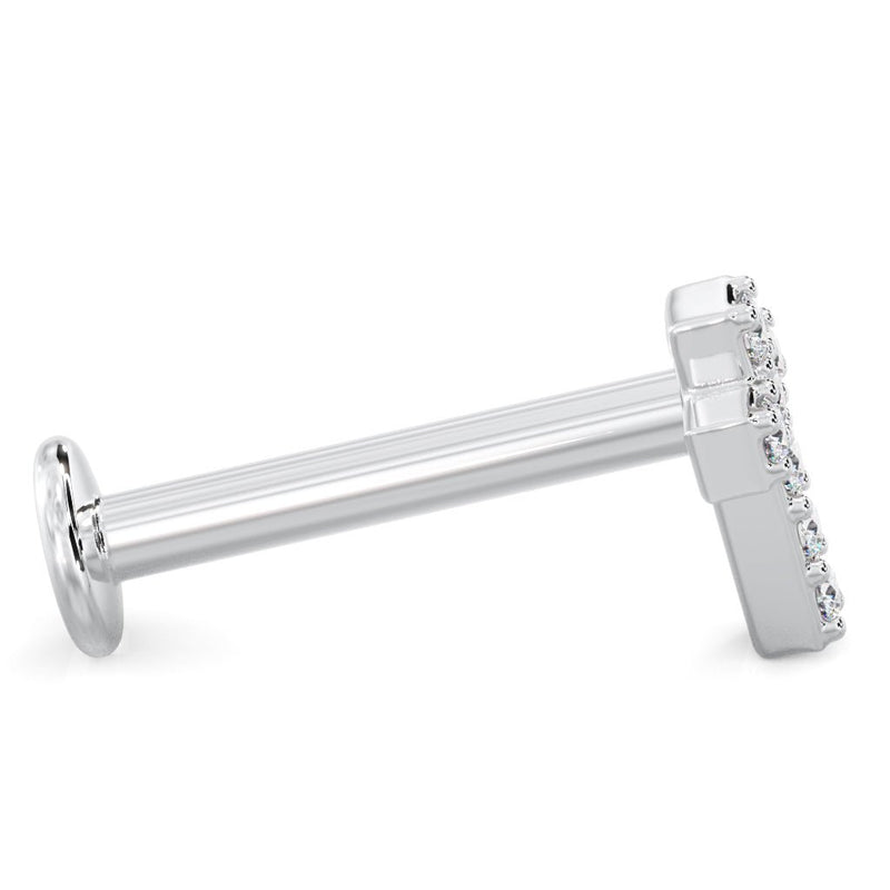 Side profile of 14k white gold diamond cross flat back labret showing full post length and low-profile setting