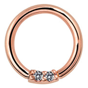 14K rose gold seamless hoop with two front-facing diamonds in prong setting, front view