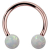 14k rose gold circular barbell with iridescent white opal ball ends, front view