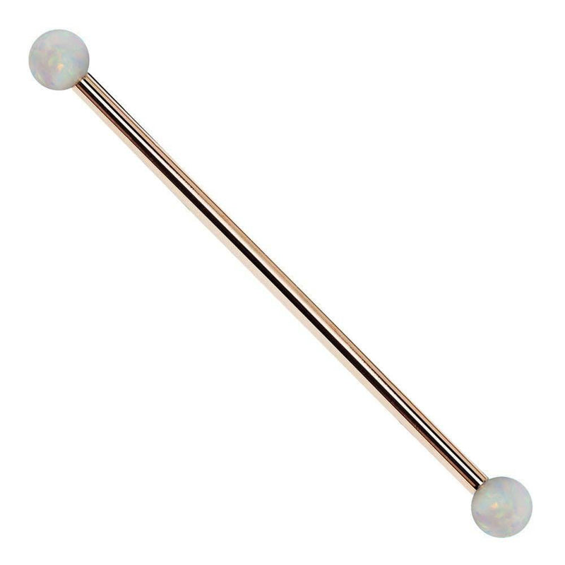 14k rose gold industrial barbell with white synthetic opal ball ends, front view